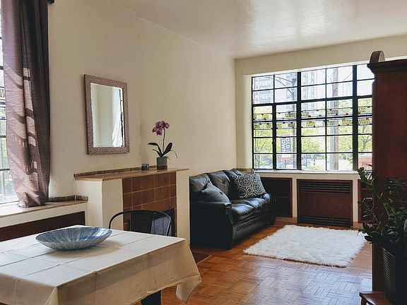 Living Rm/Dining Rm Combo- beautiful stained glass windows-