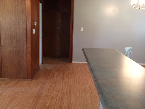 Hallway with main bathroom on the left, large storage closet