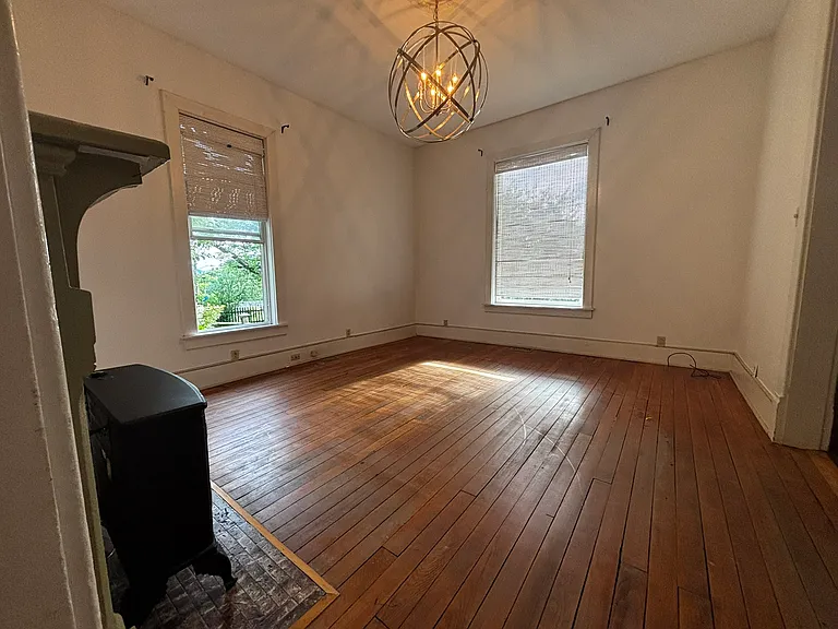 Living Room with gas burning fireplace and tv wall mount.