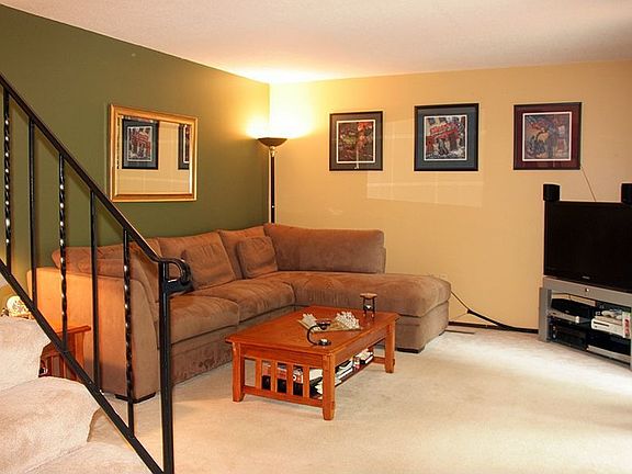 Living Room views the brick patio and the shade trees!