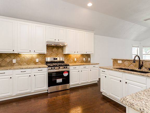 New gas stove, new ducted range hood and granite countertop