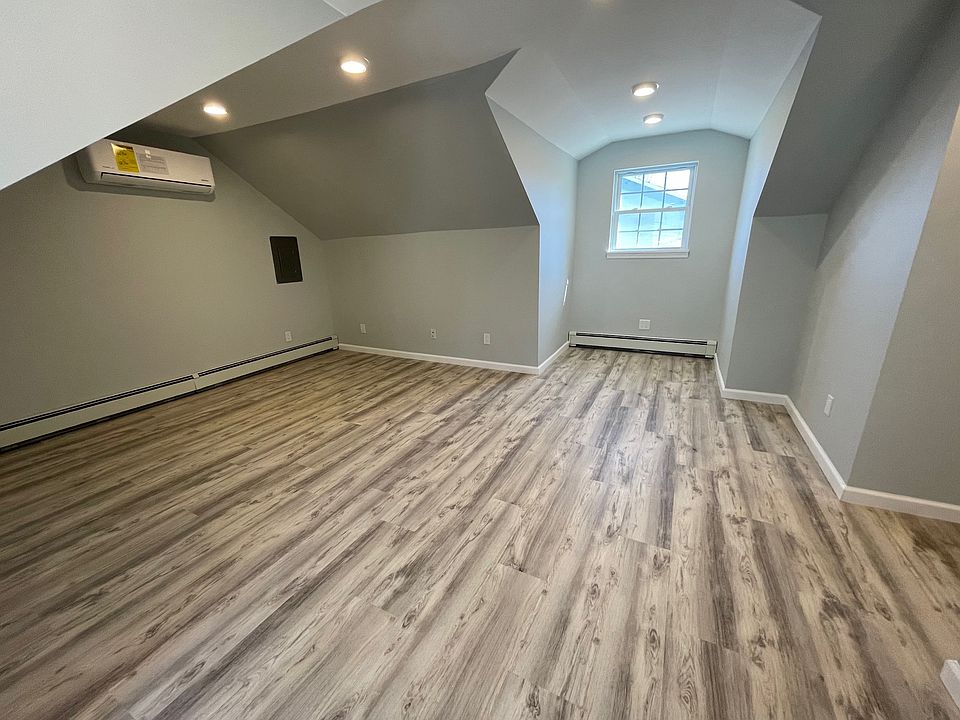 Extra large bedroom with vaulted ceilings, oversized windows that fill the space with natural light, and a large closet spacious, airy, and perfect for relaxing!