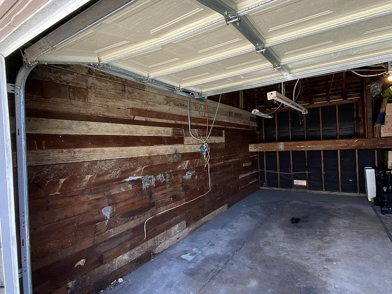 Inside of your side of the garage. The amount of storage for you is HUGE. Approximately 10ft tall by 4ft deep. This storage space is in addition to the space for your vehicle. It's big.