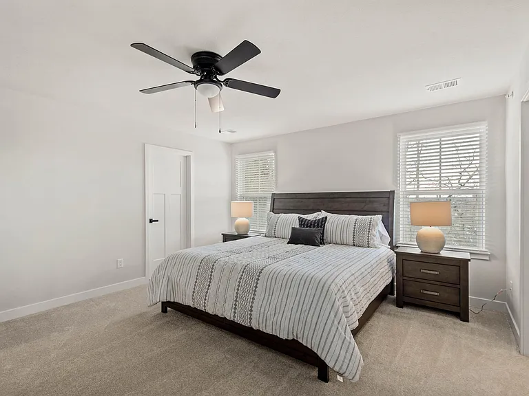 Spacious main suite features a King bed with storage drawers, double dresser and 2 walk-in closets.