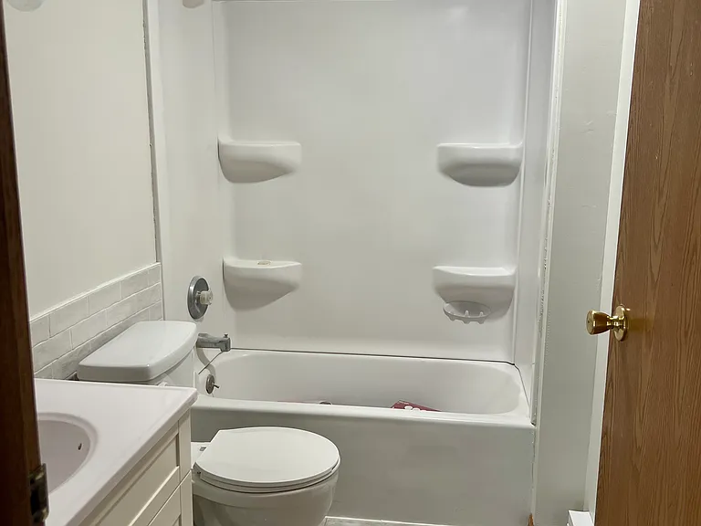 Updated bathroom with new flooring and vanity