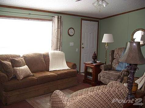 Large window in the living room provides nice lighting.