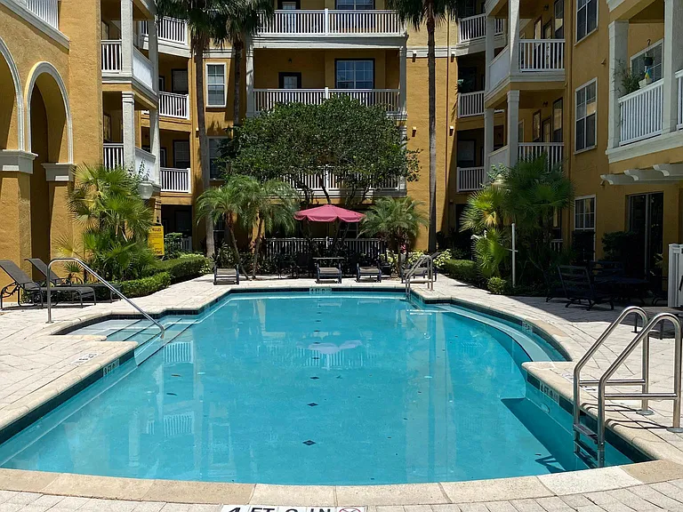 My favourite spot. Will be yours, as well. We have 2 pools on Property. This is the larger pool, close to this unit. Bathroom's right inside.