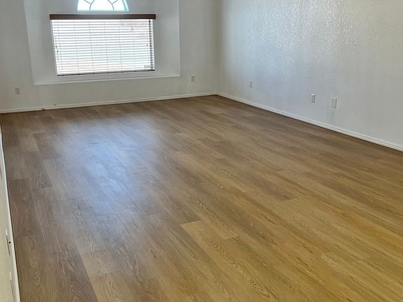 Living room with front bay window, blinds and privacy screen