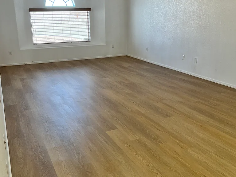 Living room with front bay window, blinds and privacy screen