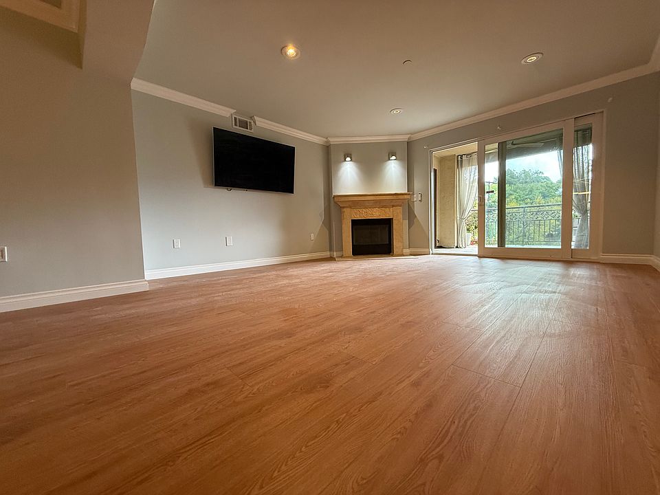 Living room with travertine fireplace