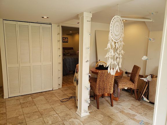 Main room for couch and tv. The kitchen will be remodeled into the current storage area allowing room for a dining table