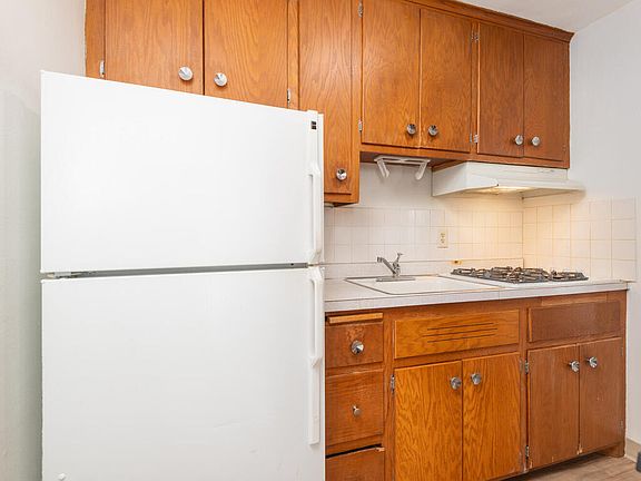 Kitchen with gas stovetop.