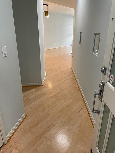 Hallway with hardwood floor