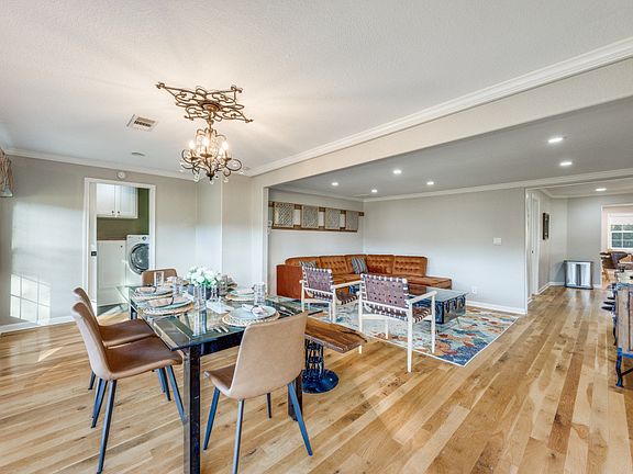 Living and dining room. Laundry room is in the background.