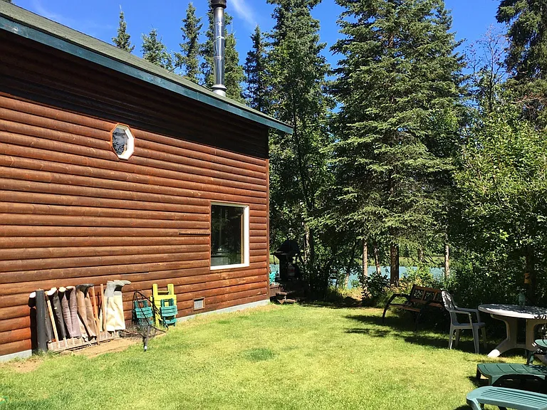 Side yard with firepit, facing river