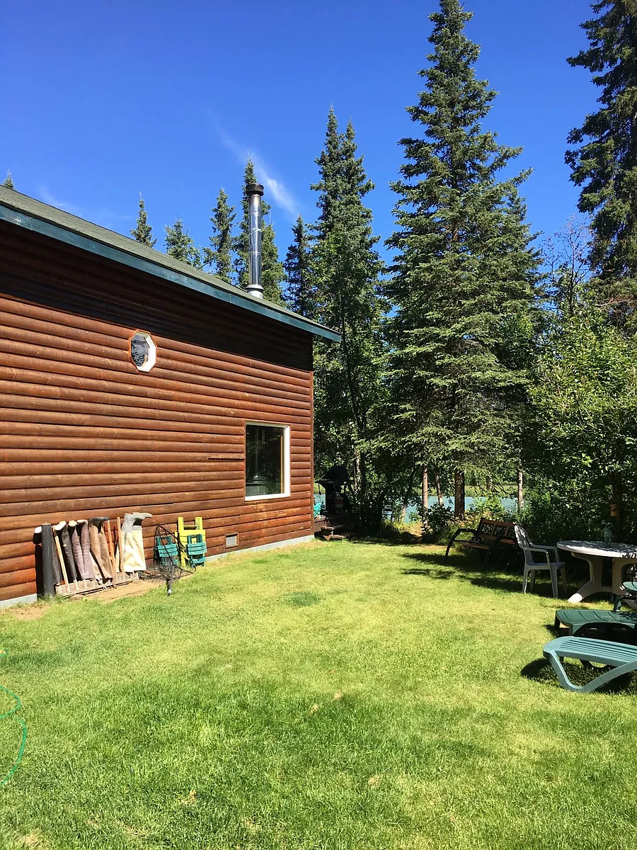 Side yard with firepit, facing river - 32992 Johnsons Dr