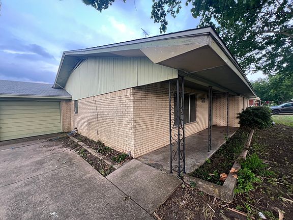 Driveway/covered front porch area.