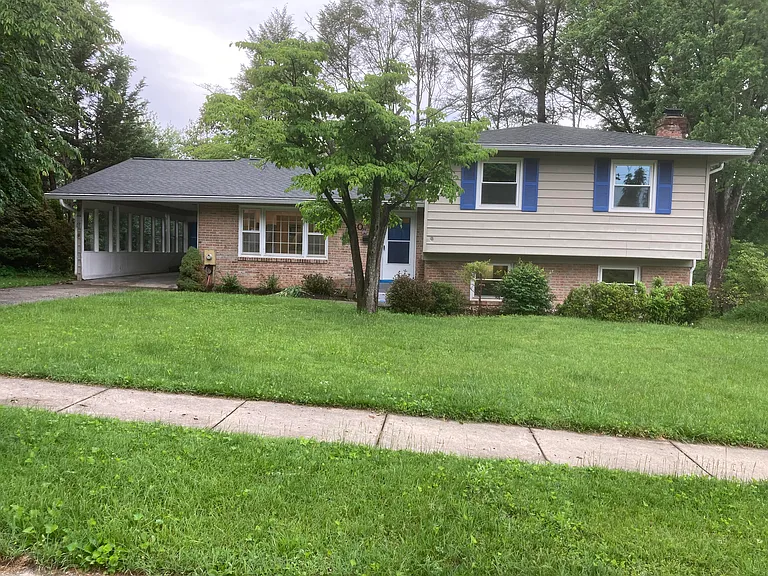 Front of house with sidewalk.