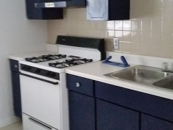 Kitchen with stove and refrigerator