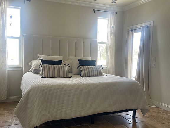 Master bedroom with door access to backyard.