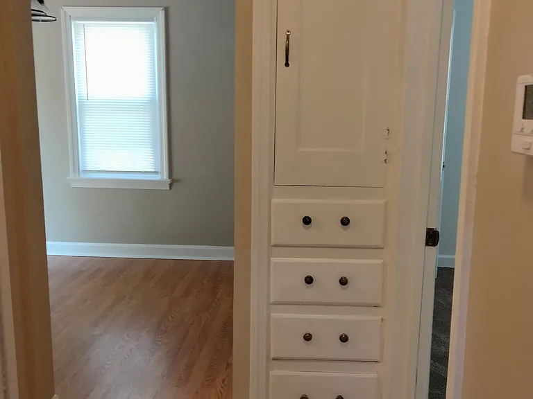 Built-in linen closet next to 1st floor bathroom