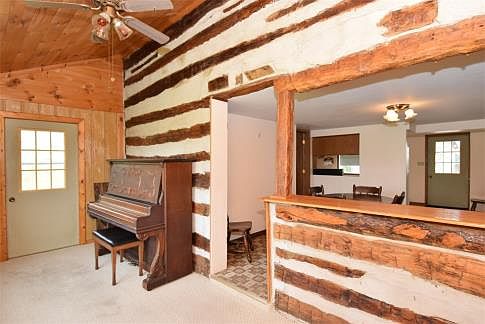 Front room w/exposed original logs