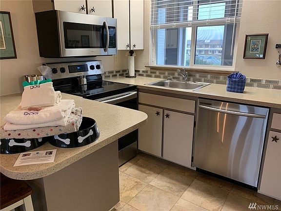 5th image of 643 Ocean Shores Blvd NW Unit 213