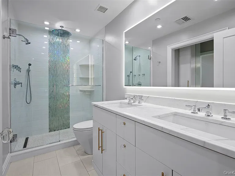 Primary bath with double vanity and spa shower