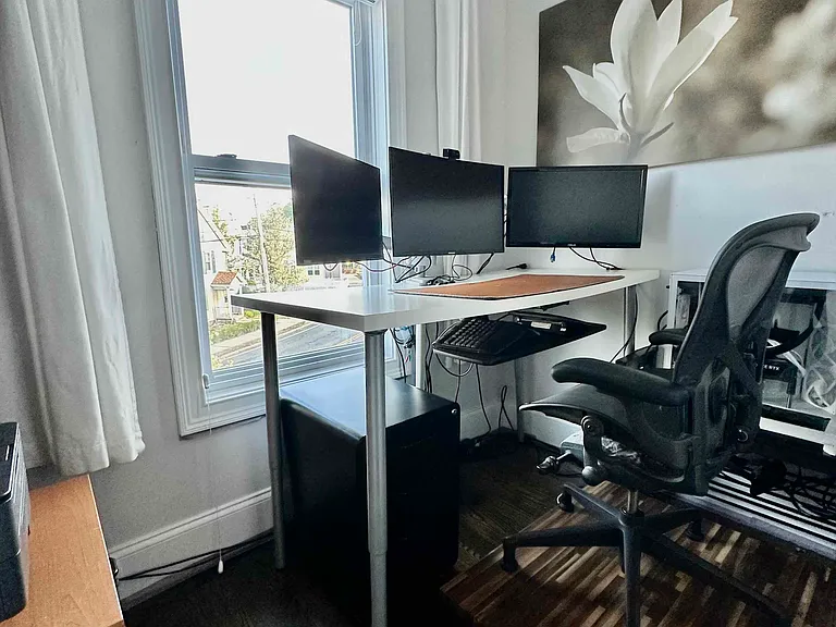 Separate windowed office, currently configured as a dedicated work-from-home space.