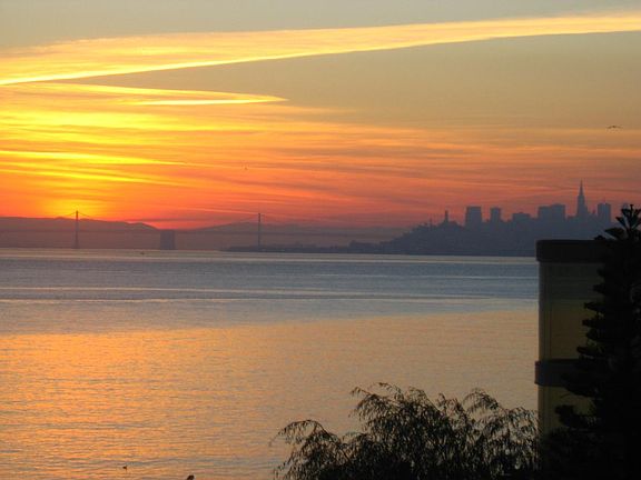 View of Skyline and Bay Bridge at Sunset from deck