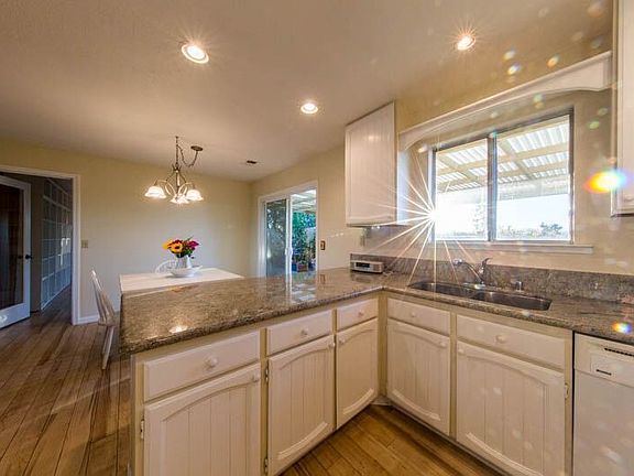 Morning sun streams into the kitchen.