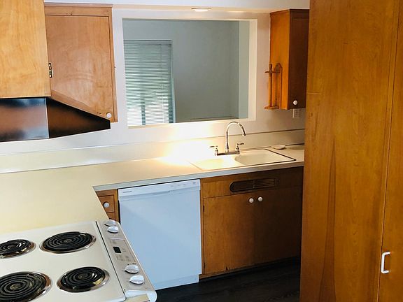 Small up dated kitchen. New flooring, dishwasher and fridge. Tons of storage.