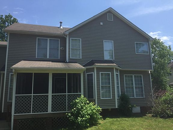 back of home with enclosed screen