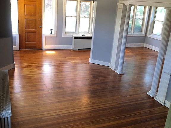 Lovely original hardwood floors and great trim details. Open living room, elegant dining room and bonus area for office/hobby space.