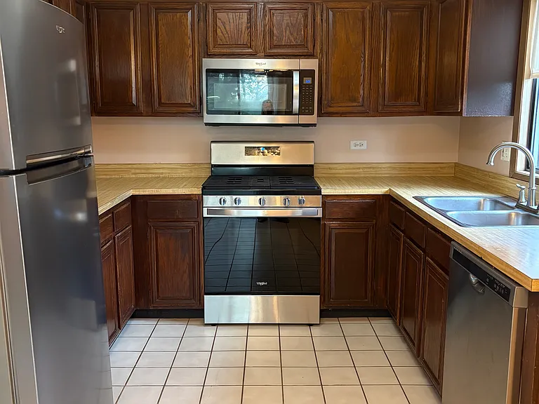 Kitchen with Newer SS Appliances