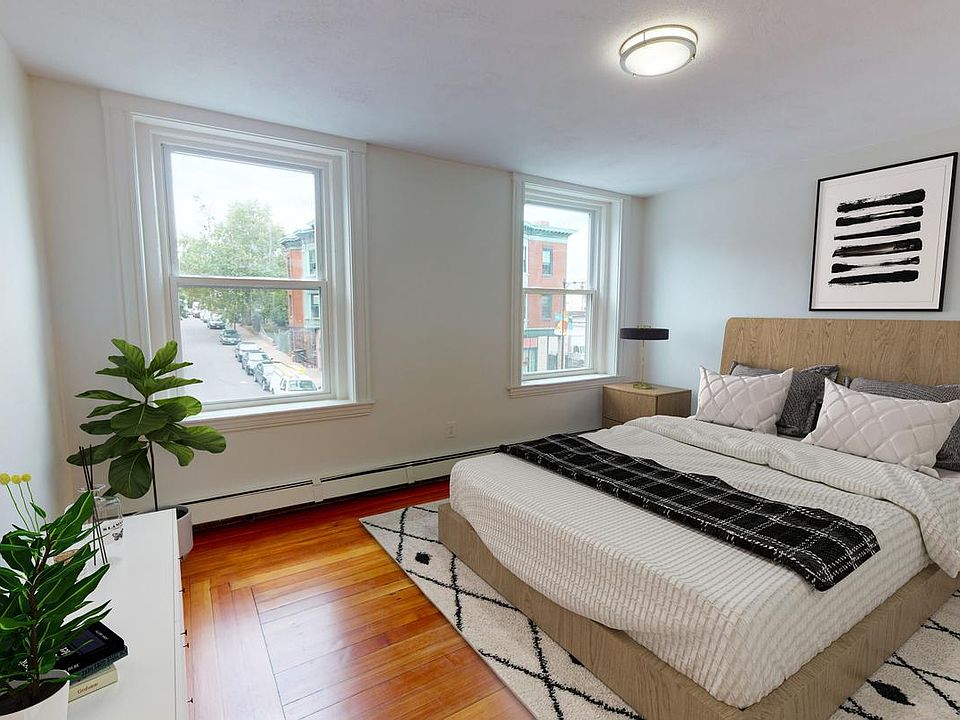Bed 2-This image shows a virtually furnished space. Bedrooms come unfurnished.