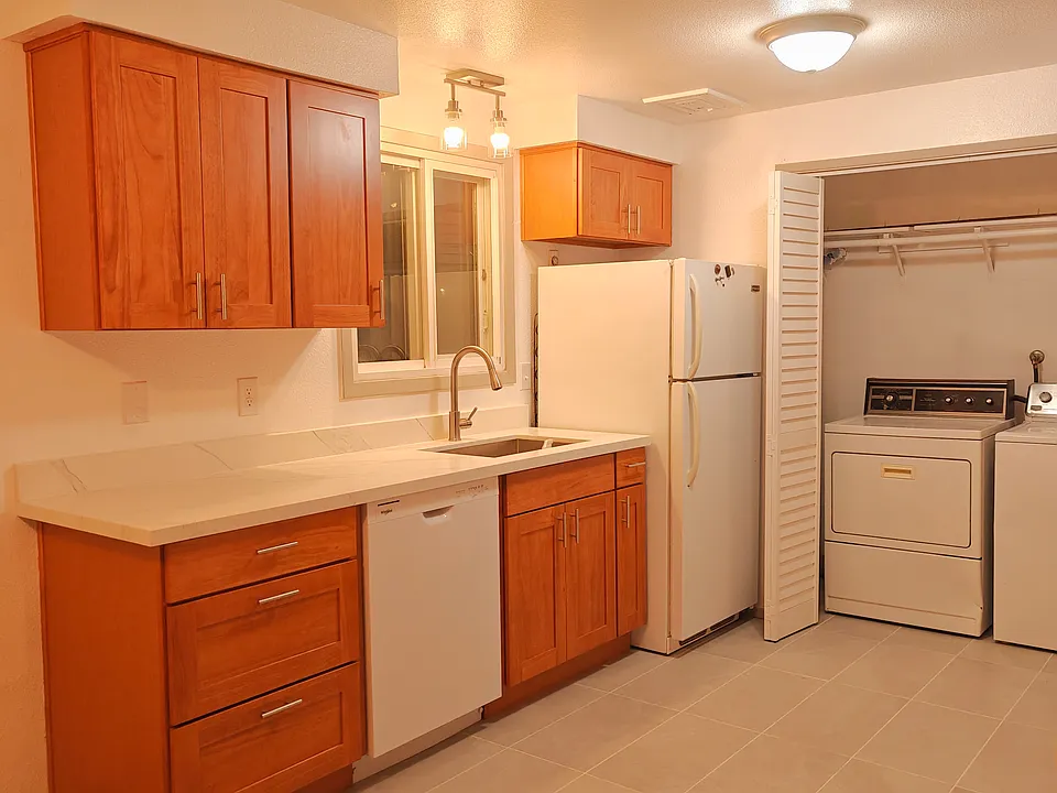 Left side of kitchen with sink and dishwasher