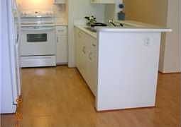 wood laminate floors in living room and kitchen