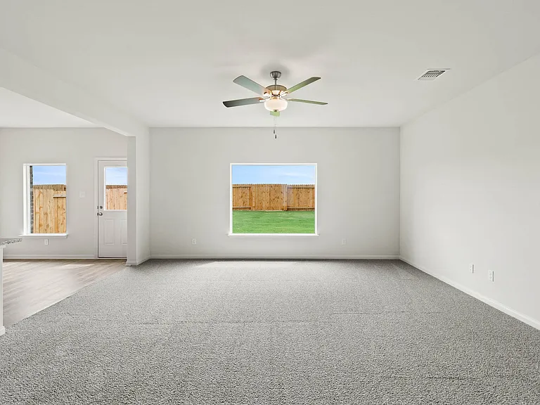 The family room has a large window that lets in great, natural lught and backyard views.