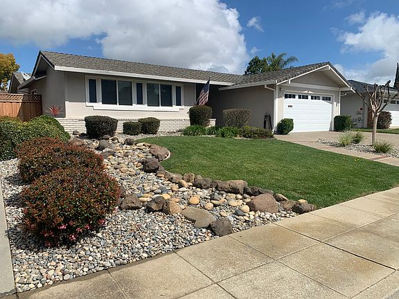 Front of house. Two car garage.