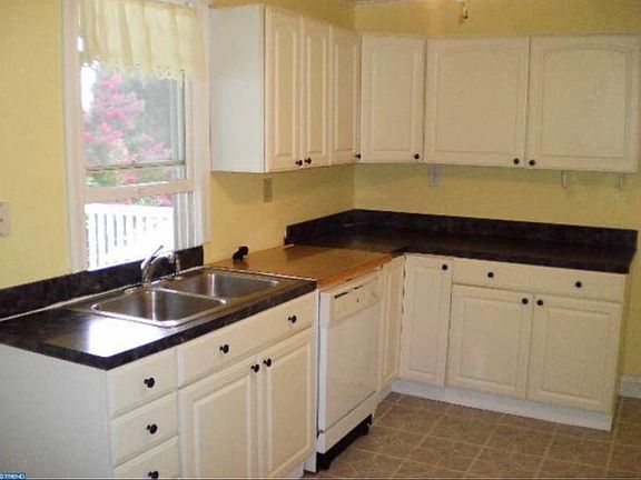 Kitchen has a dishwasher.