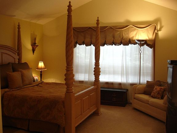 Large master bedroom with cathedral ceiling