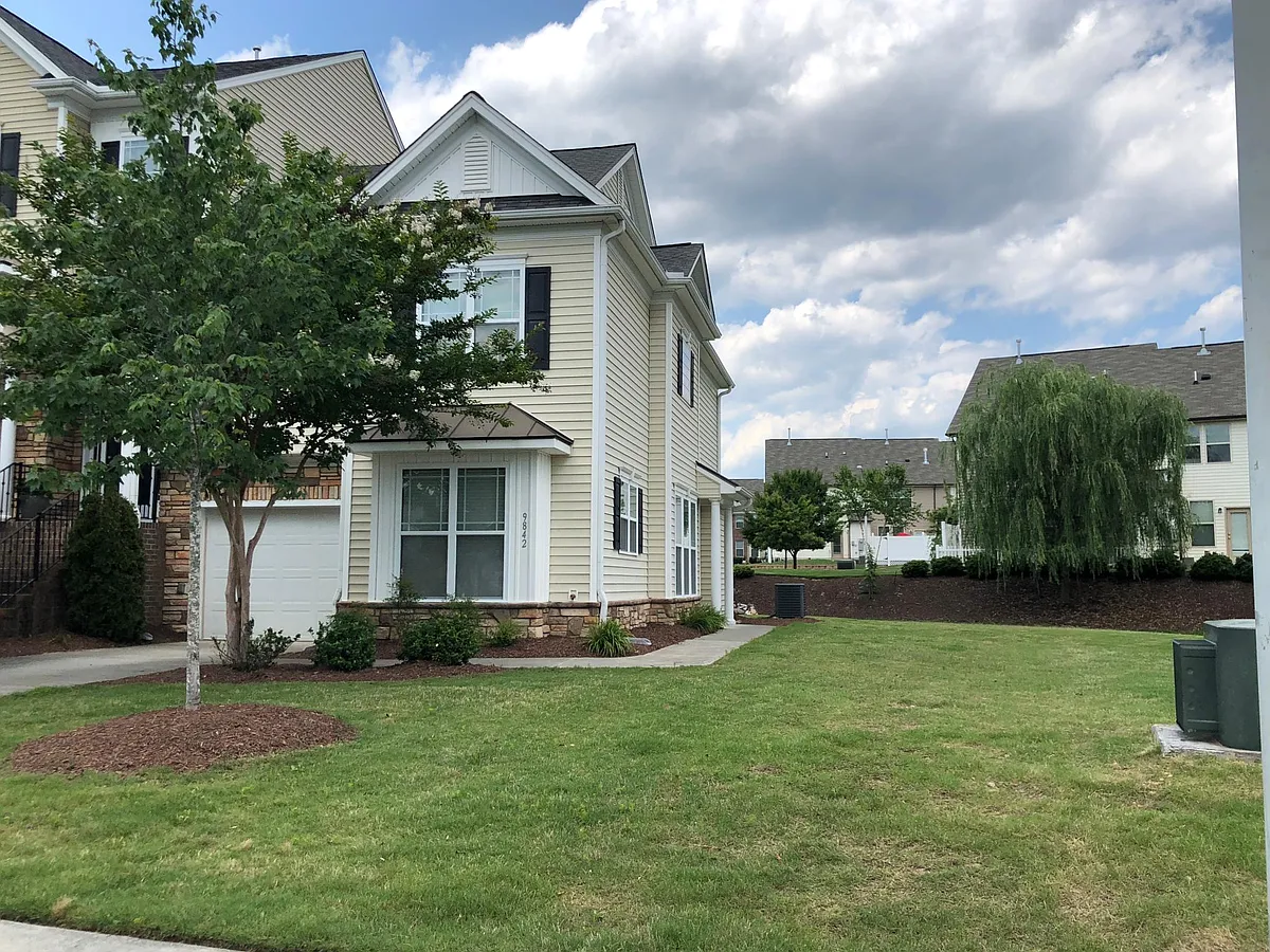 Front view showing large lawn surrounding your unit - 9842 Precious Stone Dr