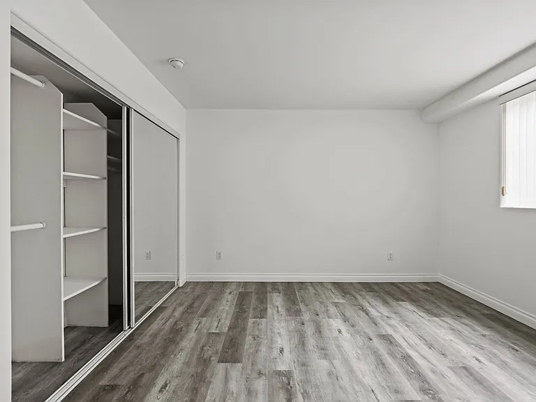 Bedroom with Large Closet with Built-In Organizers
