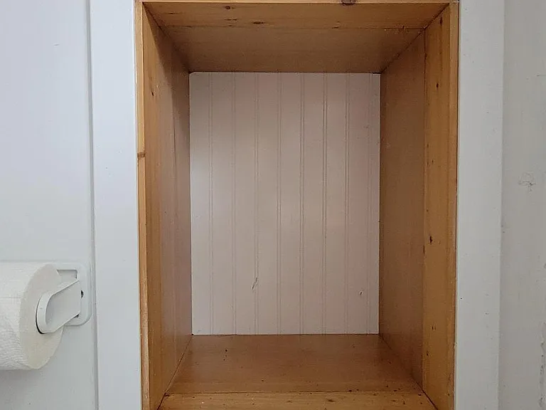Removable beadboard panel can give you a viewing window from the laundry room to the family room. 1 panel above laundry sink, one above dryer (looks to furnace room).