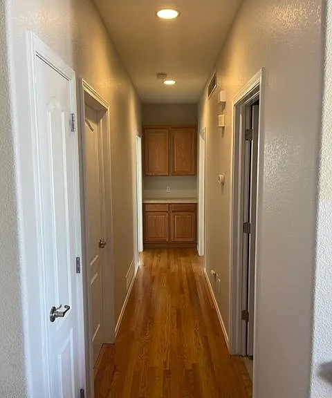 Main hallway, 2 small bedrooms on the left and bath and main bedroom on the right.