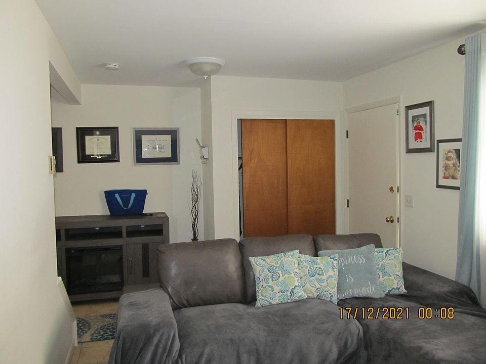 Living Rm, closet & front entry door.
