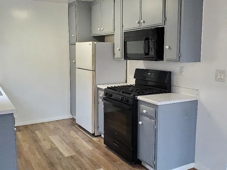 Kitchen stove, microwave and refrigerator