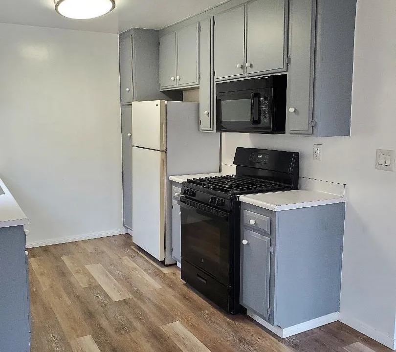 Kitchen stove, microwave and refrigerator