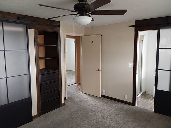Master bedroom with barn doors for closet and bathroom